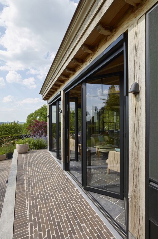 Eiken aanbouw orangerie met plat dak