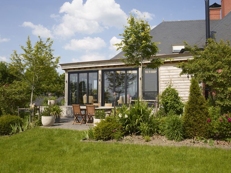 Eiken aanbouw orangerie met plat dak